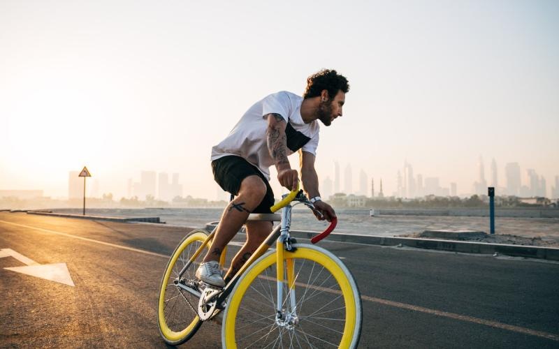 Find your perfect fit at Waller Creekside on 51st a man riding a bicycle on a road