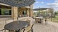 a patio with tables and chairs