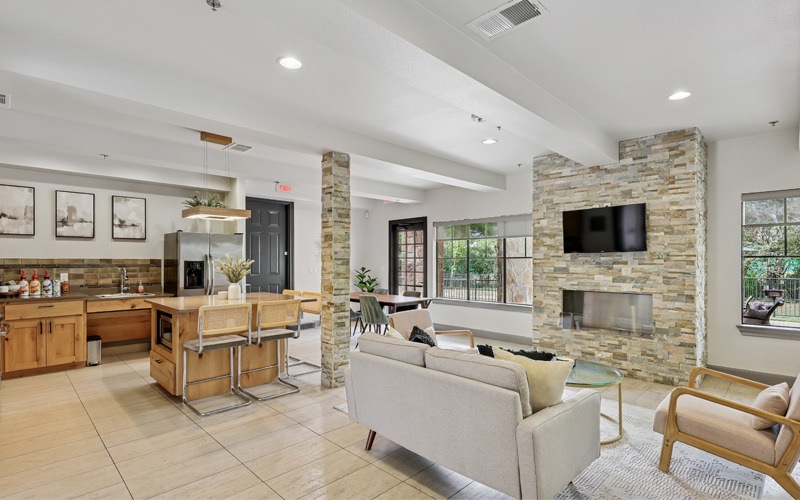 room with couch chairs and fireplace