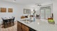 a kitchen with a sink and a dining table